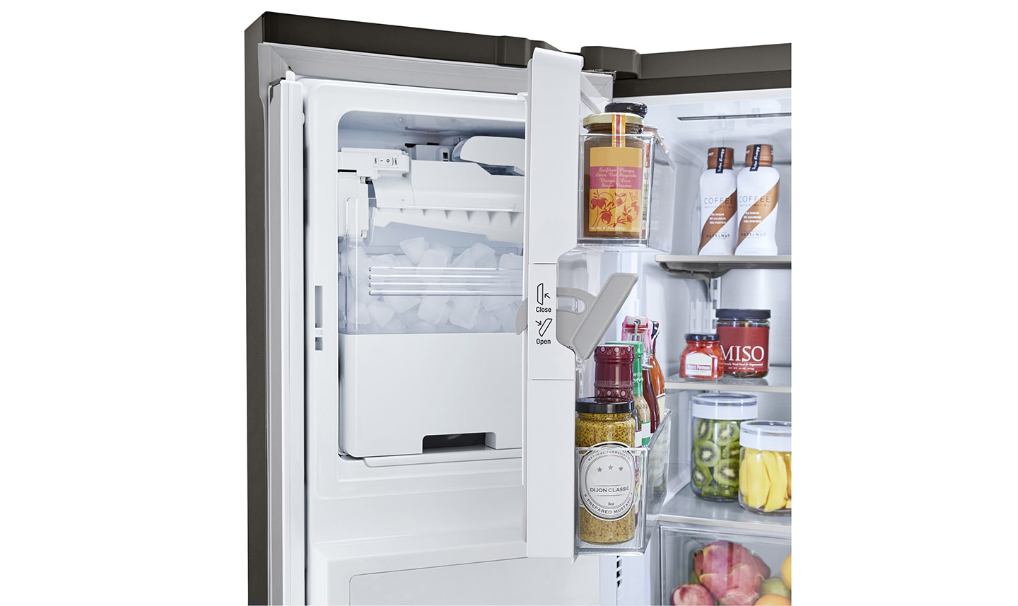 LG refrigerator partially opened to show the interior of its door-ice maker.