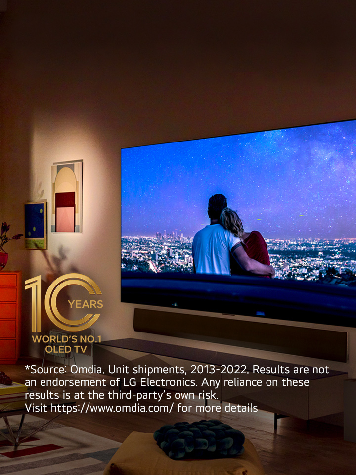 An image of LG OLED evo G3 on the wall of a modern and quirky New York City apartment with a romantic night scene playing on the screen.  10 Year World's No.1 OLED TV emblem. 