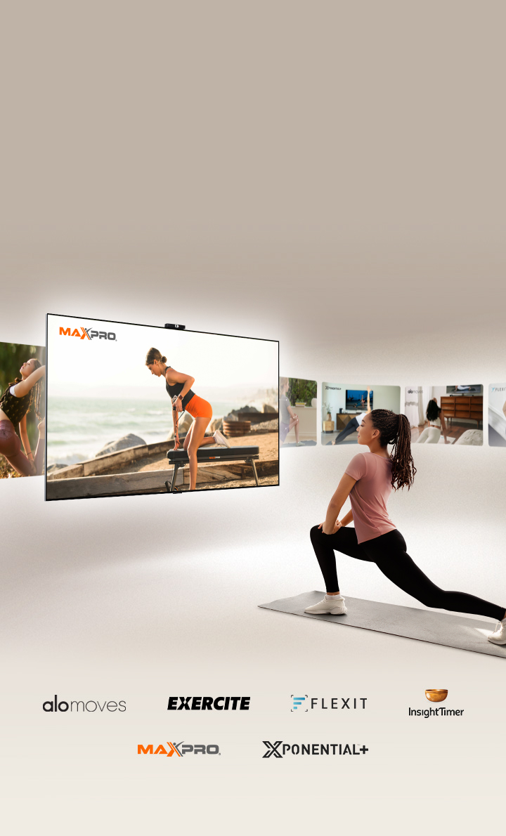 A woman is in a lunge position on a yoga mat in front of an LG TV. The TV shifts through videos of Exercite, Xponential, Alo Moves, FLEXIT, Insight Timer and Maxpro.