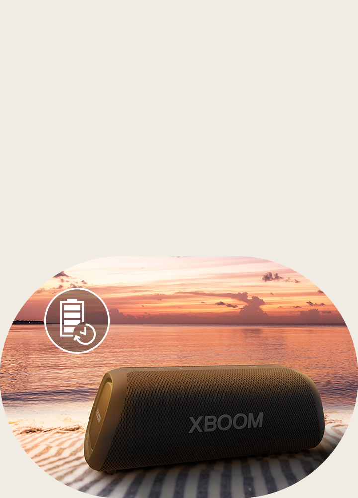 The speaker is placed on a beach towel. In front of the speaker, it shows sunset beach to illustrate that this speaker can be played up to 24 hours.