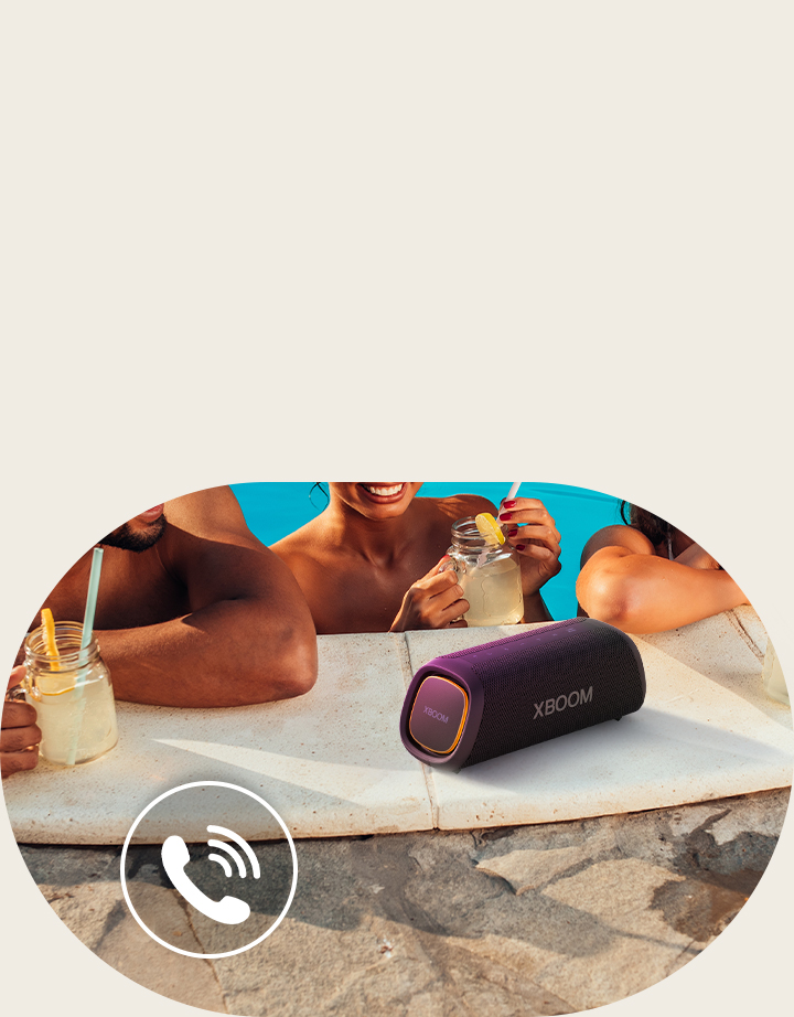 LG XBOOM Go XG7 is placed on the poolside. Three people are talking through the speaker in the pool.