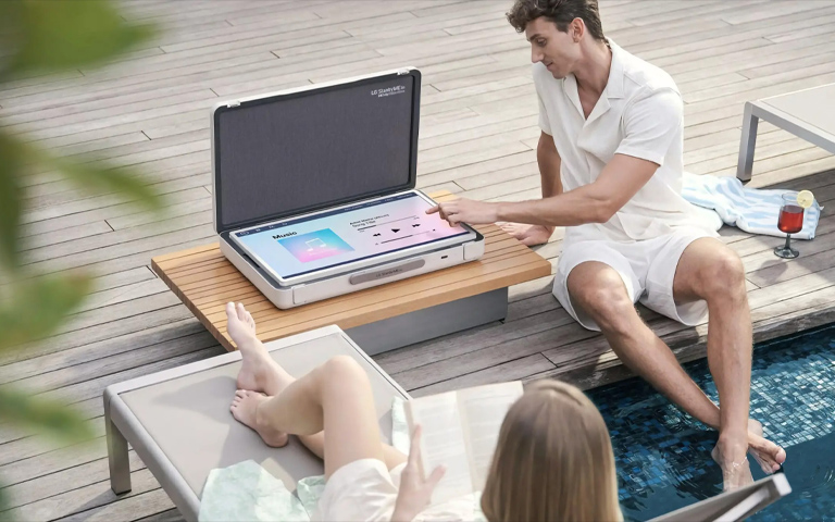 LG stanbyme go in a outdoor, pool side, listening music