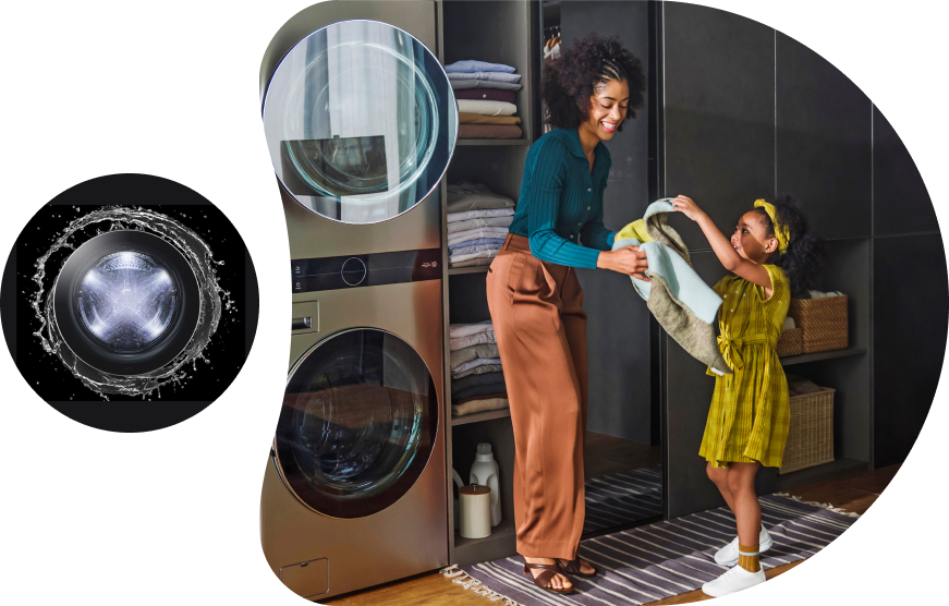 Water is spraying around the glass door of the LG drum washing machine, and a transparent stream of water is surrounding it. Women and girls are standing in front of an LG washing machine with fabric.